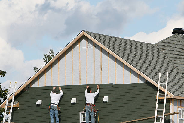 Professional Siding technician working in Leander, TX